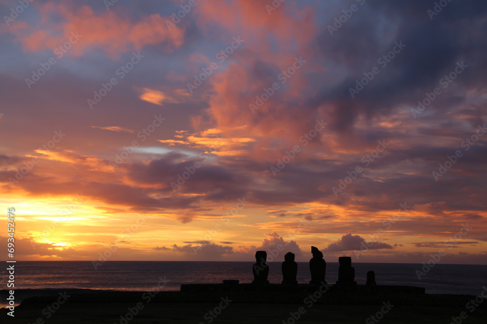 Fototapeta premium Silhouette of the Ahu Tahai ceremonial complex at sunsetEaster Island, Rapa Nui, Polynesia, Chile, South America