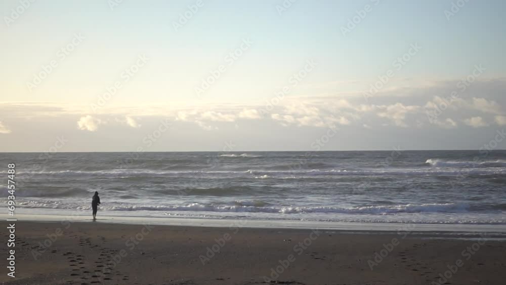 A Woman Fishing at the Ocean of Oregon Coast in Slow Motion A Woman Fishing at the Ocean of Oregon Coast in Slow Motion