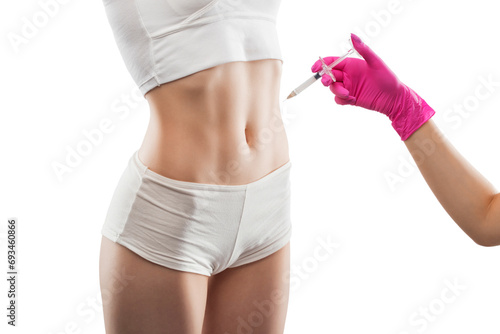 Aesthetic cosmetologist makes lipolytic injections to burn fat on the body of a woman. Female aesthetic cosmetology in a beauty salon.Cosmetology concept. photo