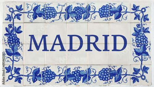 Obraz na plátně Madrid on Frame of Azulejos (name of Spanish tiles) with blue bunches of grapes