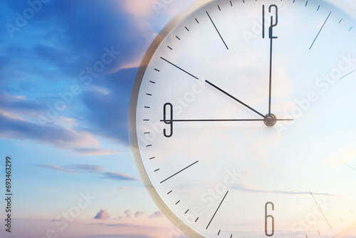 Time concept. Double exposure of beautiful blue sky with clouds and clock