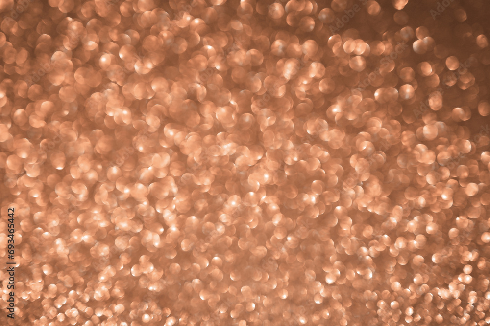 Peach fuzz sparkling glitter bokeh background Peach fuzz sparkling glitter bokeh background