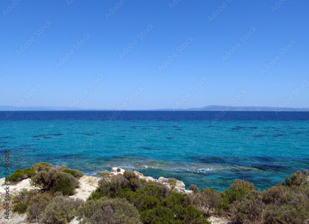 Panorama of white rocks, blue sky and blue sea. Summer concept.