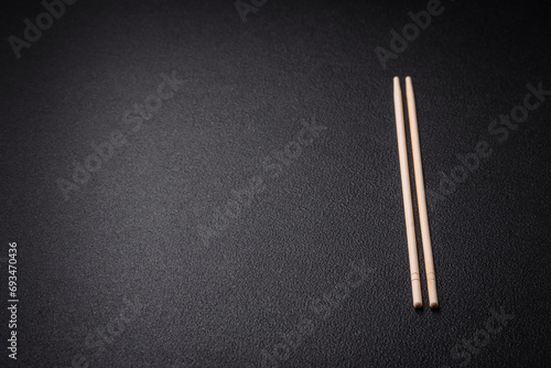 White wooden chopsticks for Asian dishes with copy space