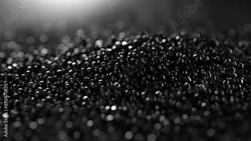 close up of a black surface, 3d black tiny plastic cylindrical grains , black plastic polymer pellets,polymer for pipes, Plastic and polymer industry, industry. Microplastic products.