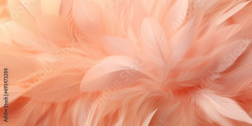 Close-up of beautiful delicate Peach Fuzz colored feathers for copy space. The trend of 2024.
