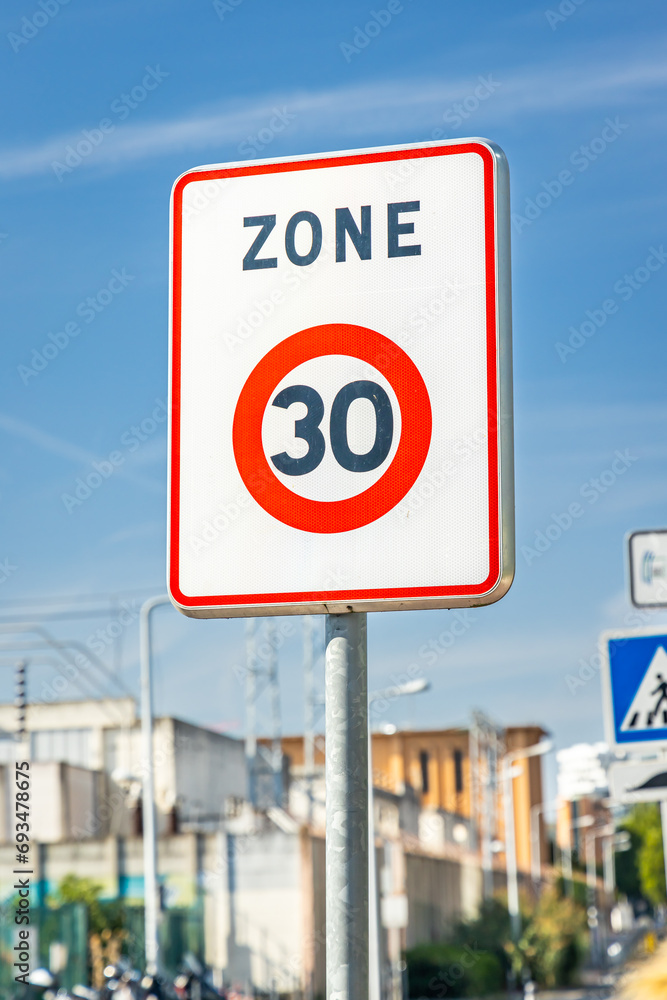 Zone 30 road sign, indicating the limit zone of thirty kilometers per hour for cars and other vehicles Zone 30 road sign, indicating the limit zone of thirty kilometers per hour for cars and other vehicles