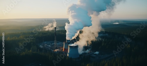 Dawn aerial view of metallurgical plant with smoke and smog emissions impacting ecology