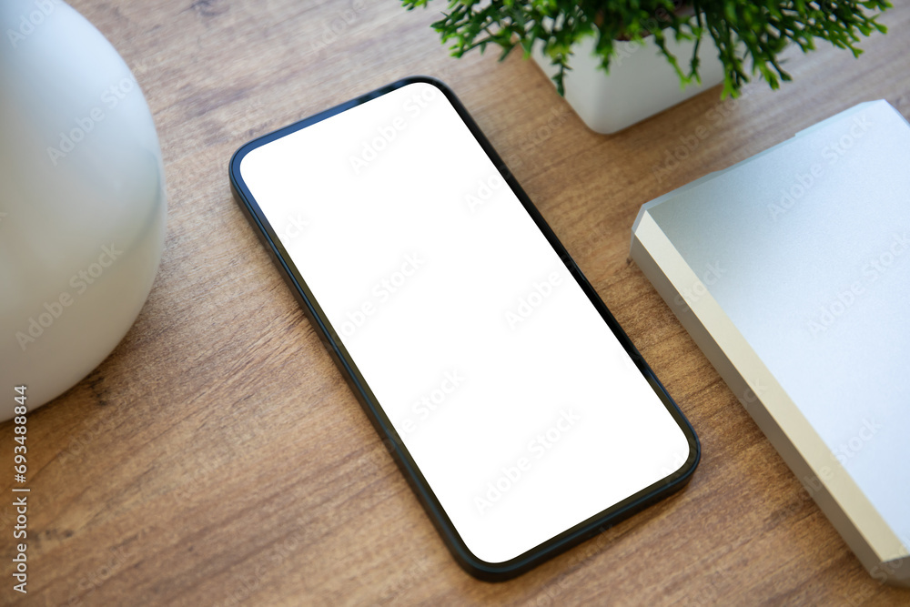 phone with isolated screen background of wooden table in office phone with isolated screen background of wooden table in office