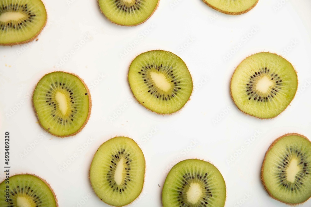 Fototapeta premium Kiwi slices on a white background