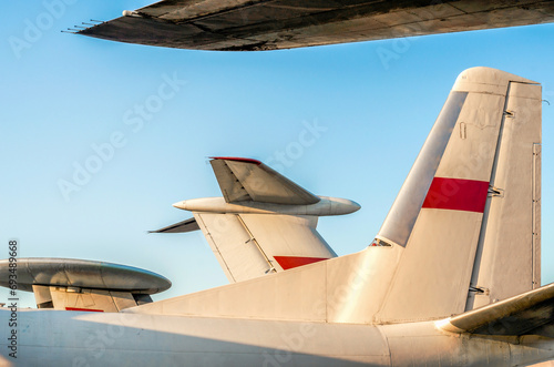 background wings of a large soviet airliner against a blue sky isolated