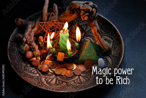 Magic power to be Rich. Witch altar with candles, old coins, stone runes, pentacle on dark table close up. Magic for attracting money, wealth. witchcraft. spiritual esoteric ritual