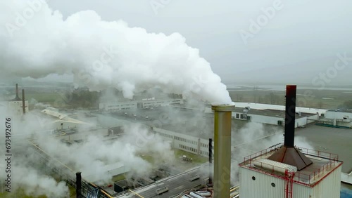 Smoke from a chimney of a fiber glass factory called NEG Nippon Electric Glass photo