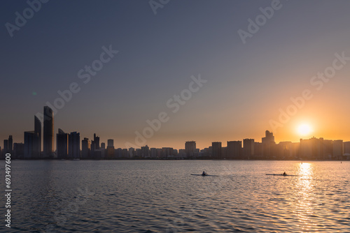 sunrise overlooking city scape, people relaxing in the capital city of Abu Dhabi © Piak