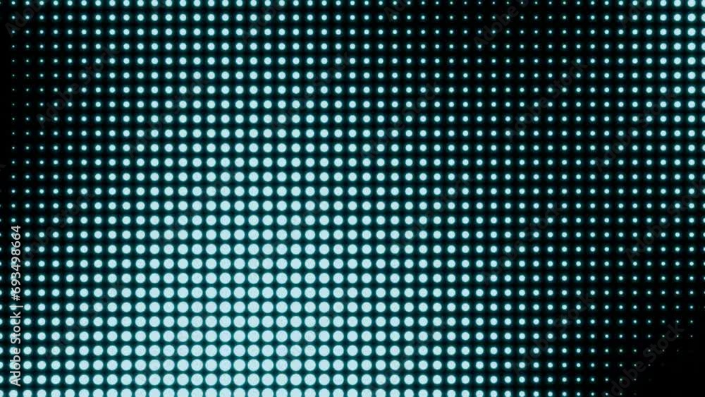 A lot of small dots move from side to side and change color. Background with moving abstract objects. Looped video.