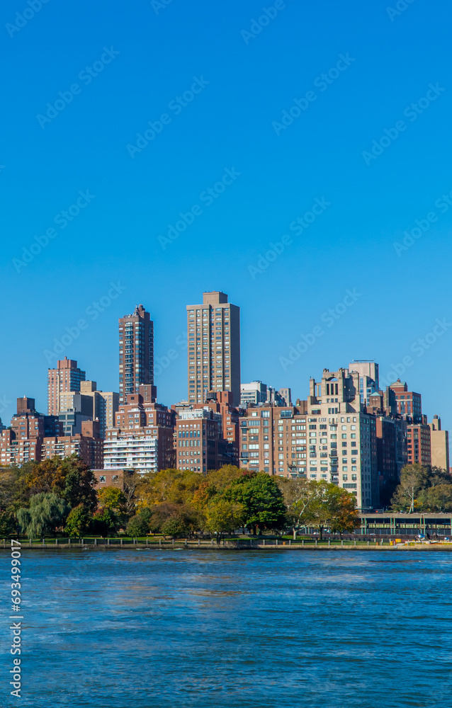 Panoramic view of buildings in central Manhattan New York seen from the East River