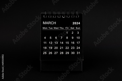 Black Calendar for March 2024. Desktop calendar on a black background.