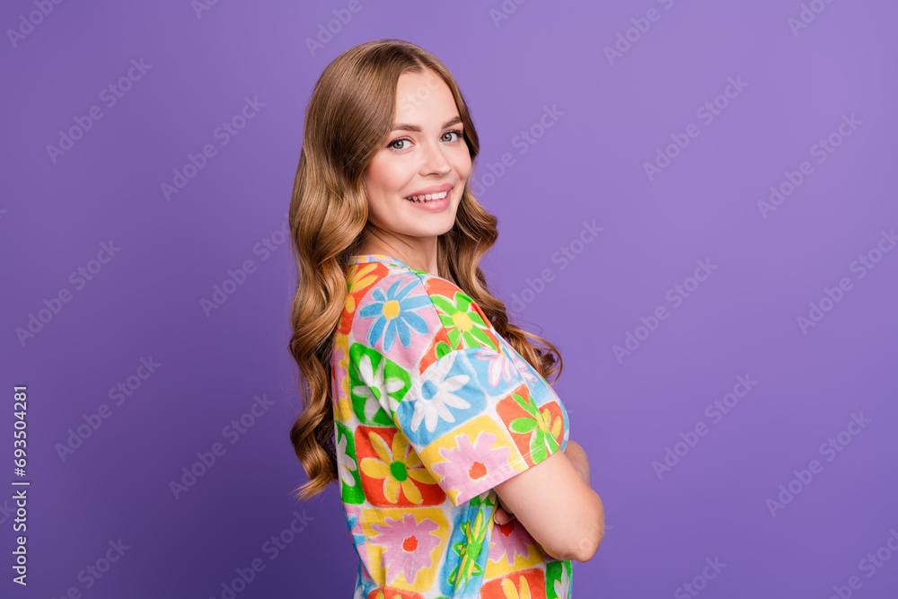 Side profile photo of charming gorgeous smiling lady crossed hands looks perfect in summertime isolated on violet color background Side profile photo of charming gorgeous smiling lady crossed hands looks perfect in summertime isolated on violet color background