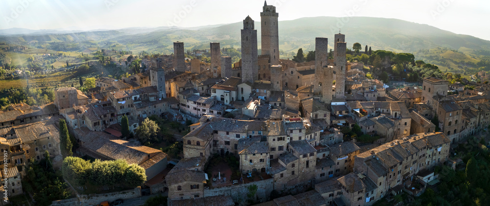 San Gimignano - one of the most beautiful medieval towns in Tuscany, Italy. aerial drone view of the towers in the morning light . Unesco heritage site..