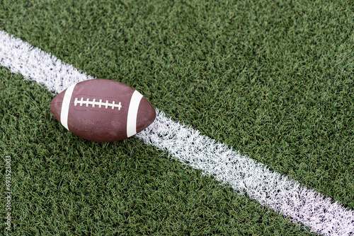 American football on football field background