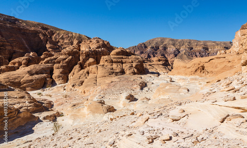 Sinai desert. Yellow and orange sandstone textured carved mountain, bright blue sky. Egyptian desert landscape. Sinai peninsula, Egypt © Анастасия Смирнова