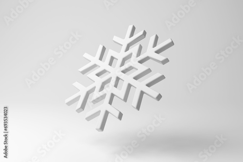 White snowflake floating in mid air on white background in monochrome and minimalism. Illustration of the concept of winter