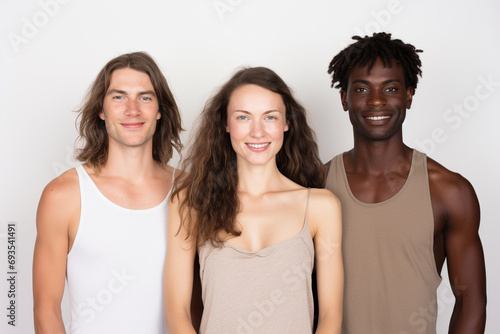 Different races are happily posing side by side in front of a white background