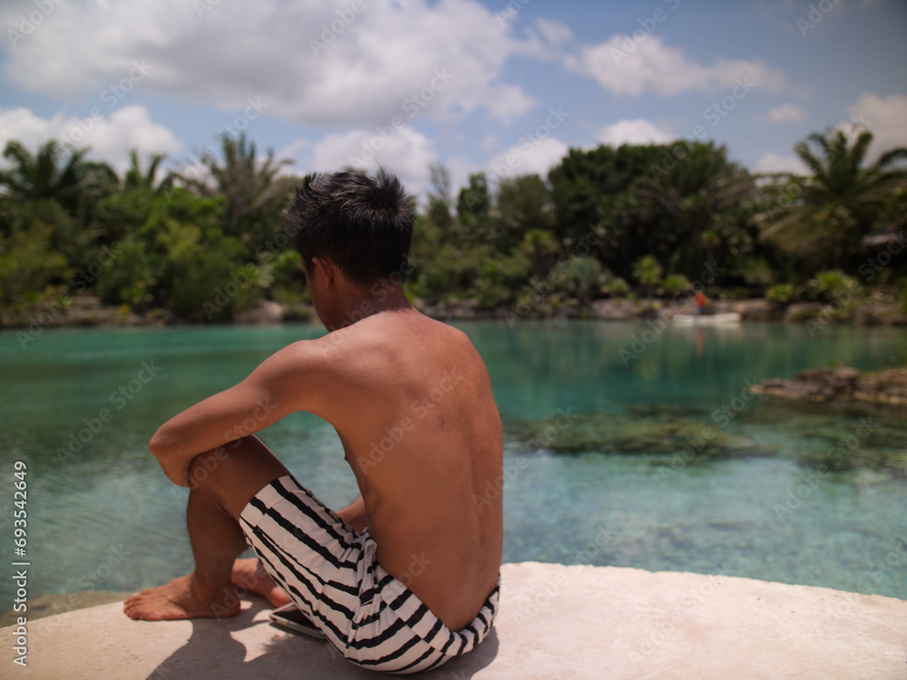 Fototapeta premium natural pool with turquoise water in chankanaab beach adventure park in san miguel de cozumel, quintana roo, mexico 