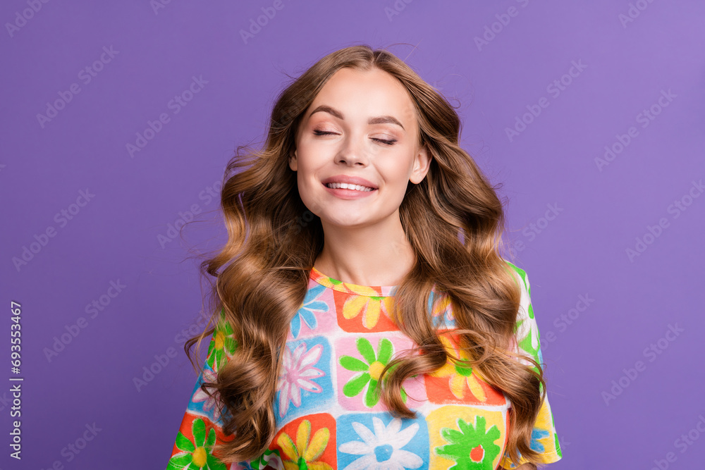 Portrait of closed eyes model blonde hair curls carefree wave head with perfect hairstyle after shower isolated on purple color background Portrait of closed eyes model blonde hair curls carefree wave head with perfect hairstyle after shower isolated on purple color background