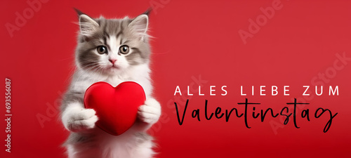 Alles Liebe zum Valentinstag, Grußkarte mit deutschem Text - Niedliches Katze hält rotes Herz , isoliert auf rotem Hintergrund © Corri Seizinger