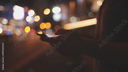 Asian attractive woman backpacker chatting on phone while walk in city. Beautiful woman tourist traveler travel alone on street using smartphone enjoy spend time on holiday vacation trip at night road photo