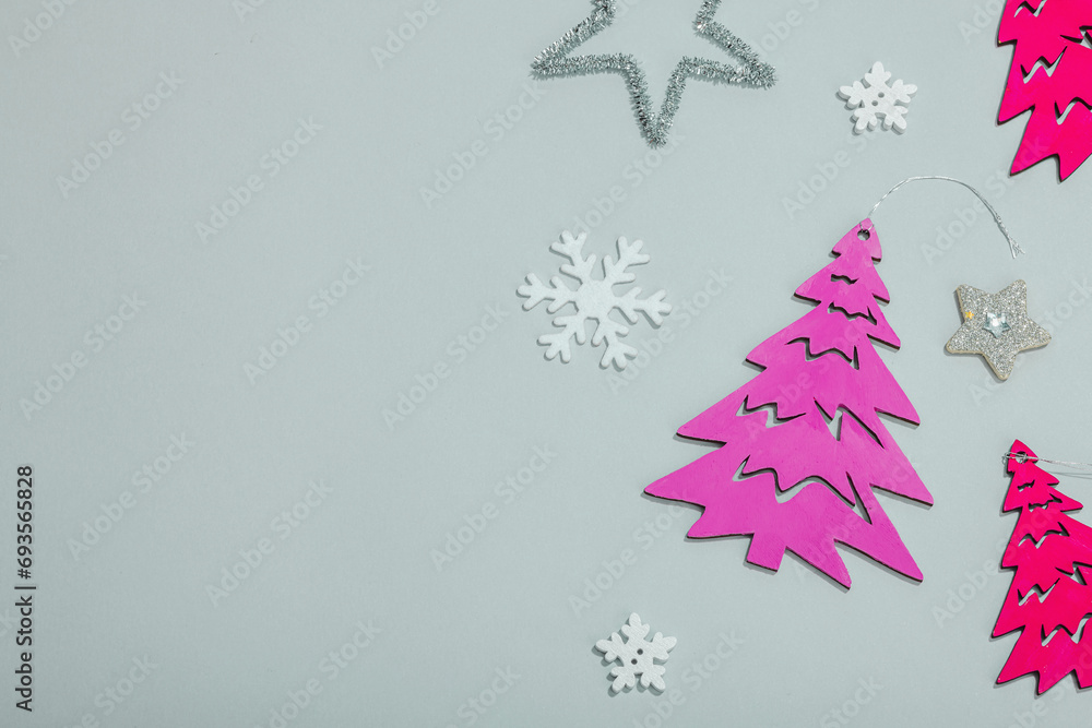 Traditional New Year composition in pink color tones. Festive decor, handmade Christmas trees Traditional New Year composition in pink color tones. Festive decor, handmade Christmas trees