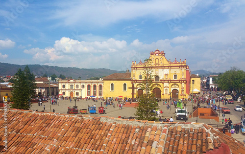visitors walk in front of the baroque cathedral in La Plaza De La Paz in San Cristobal de las Casas, Chiapas, 