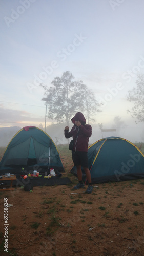 A climber surrounded by fog on Arang Hill in the morning photo