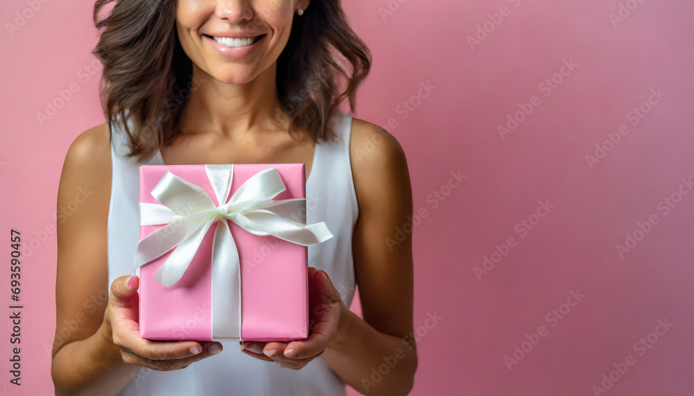 Happy Woman Holding a Gift Box - Joyful Surprise for a Birthday Celebration Happy Woman Holding a Gift Box - Joyful Surprise for a Birthday Celebration