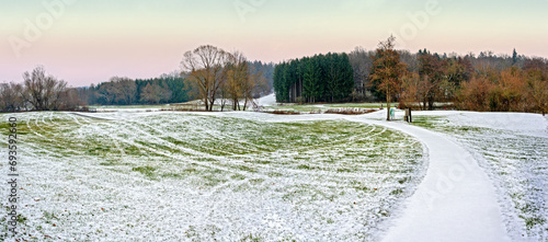 golf course at winter with snow and pathway in Bath Tatzmannsdorf in the region Burgenland, Austria