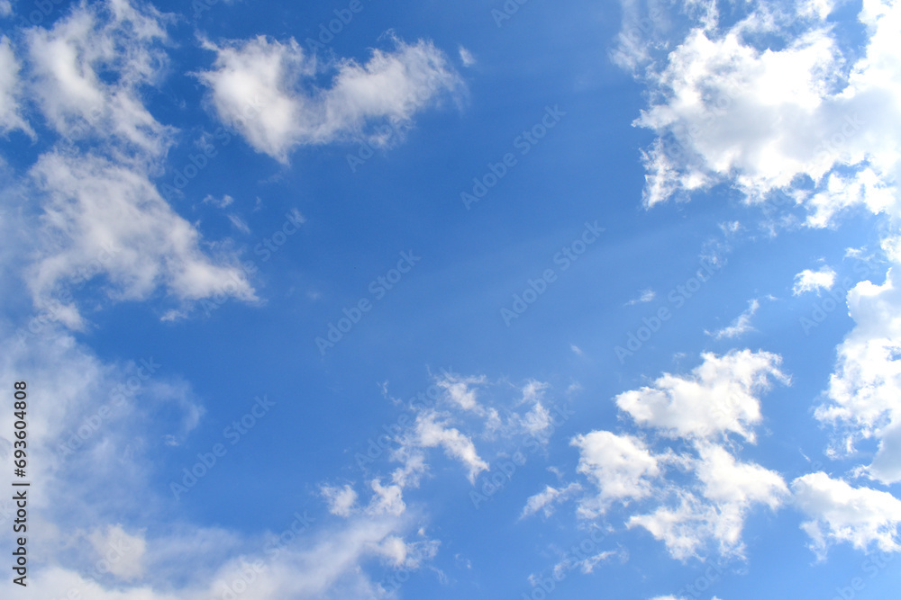Blue sky with white fluffy cloud. Beautiful sky in the morning. The concept of the freedom of life, never give up and new life beginning. Blue sky with white fluffy cloud. Beautiful sky in the morning. The concept of the freedom of life, never give up and new life beginning.