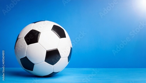 Soccer ball Isolated  blue background  text space