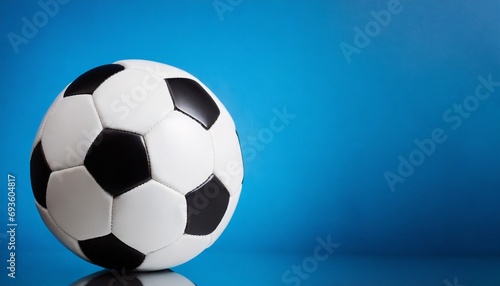 Soccer ball Isolated, blue background, text space 