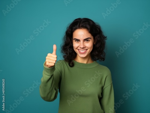 Pointing. Close-up photo of a happy woman, Young woman pointing her finger 
