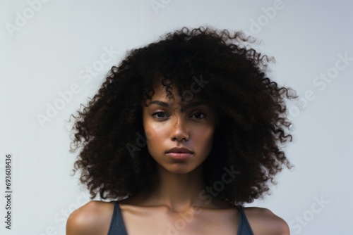 Beauty portrait of african american girl with clean healthy skin on white background