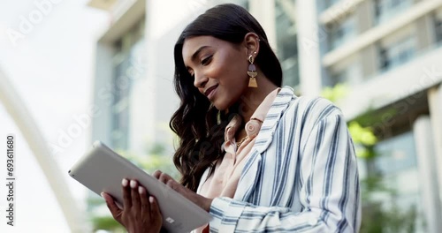 Tablet, research or business woman in city, reading email online or information. Technology, typing or Indian consultant in urban town, networking or communication on internet, scroll or remote work