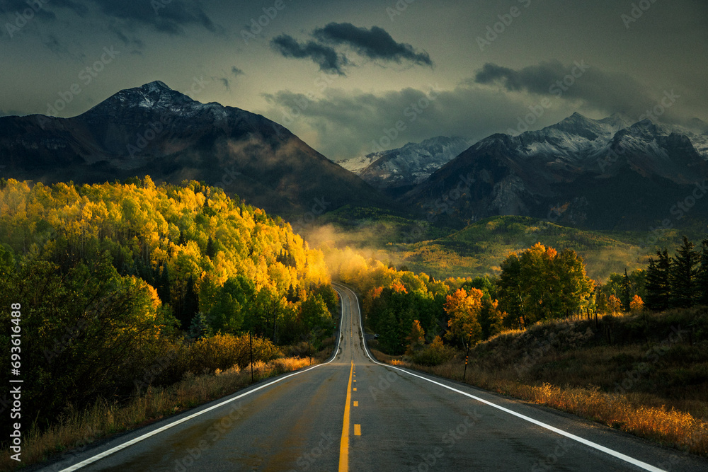 Naklejka premium Mountain Highway with Sunset Fall Colors after a Rain near Telluride