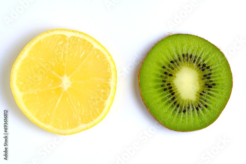 Slice of juicy lemon and ripe kiwi on white background.