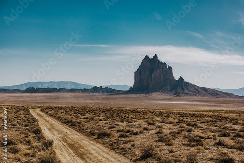 Dirt road headed to Shiprock Monument in New Mexico photo