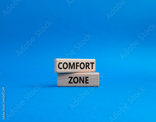 Comfort zone symbol. Concept word Comfort zone on wooden blocks. Beautiful blue background. Business and Comfort zone concept. Copy space
