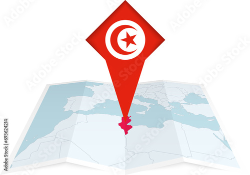 Tunisia pin flag and map on a folded map photo