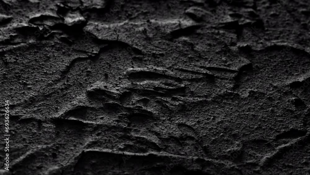 Rough rocky dark surface. Dark crumpled texture surface. Used as a background and texture. Rough rocky dark surface. Dark crumpled texture surface. Used as a background and texture.