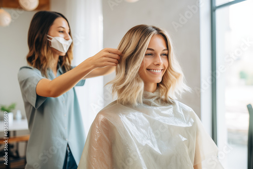 Hairdressers demonstrating DIY hair care tips, with space for at-home hair care advice