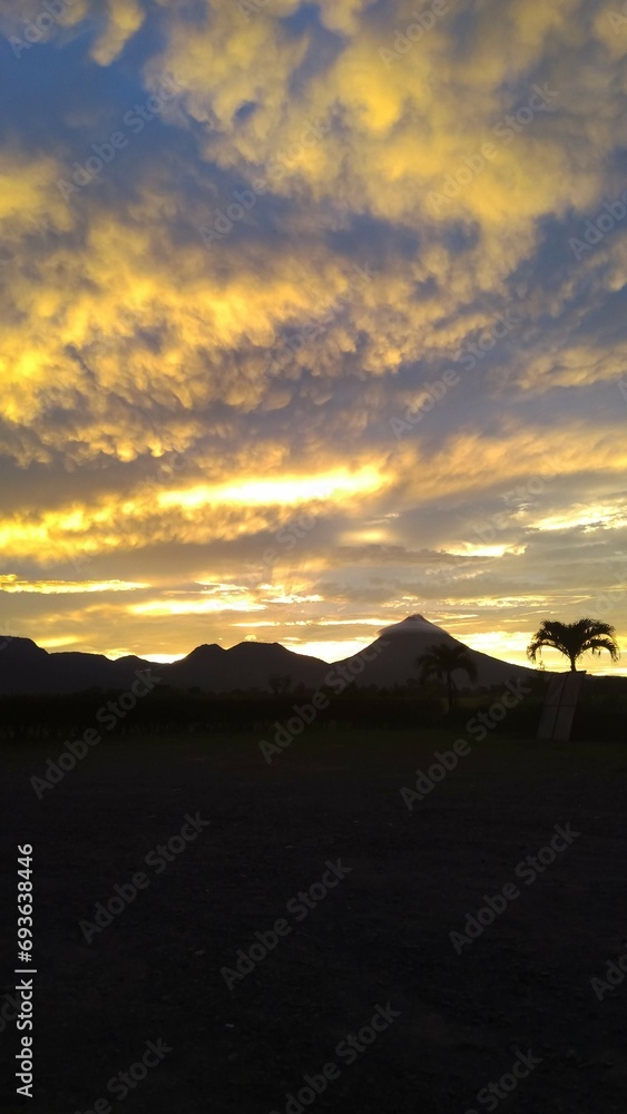 sunset in the mountains and Volcán Arenal (Arenal Volcano)